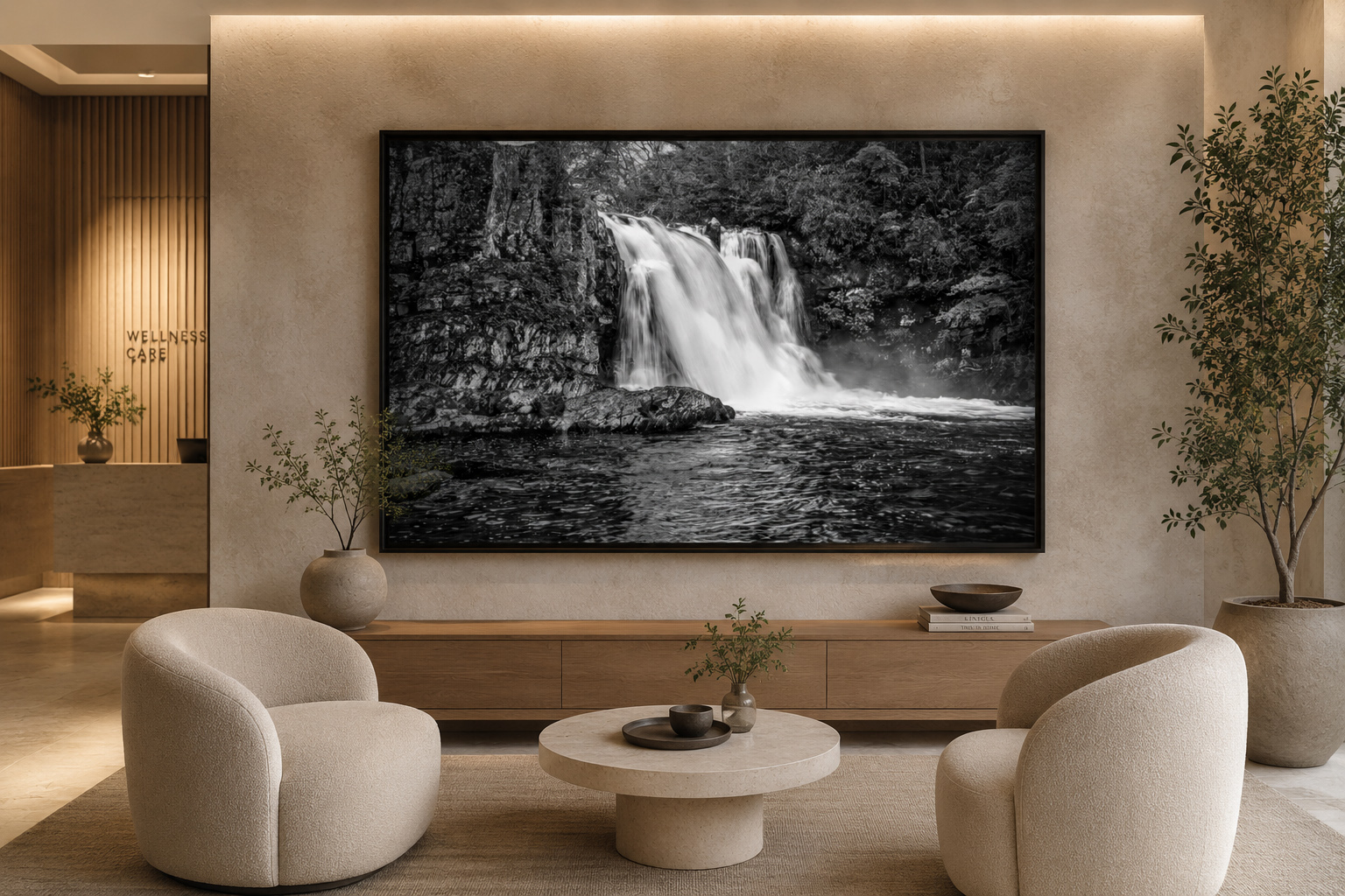 Large black and white waterfall photograph installed in a warm wellness care waiting room interior by Dan Sproul